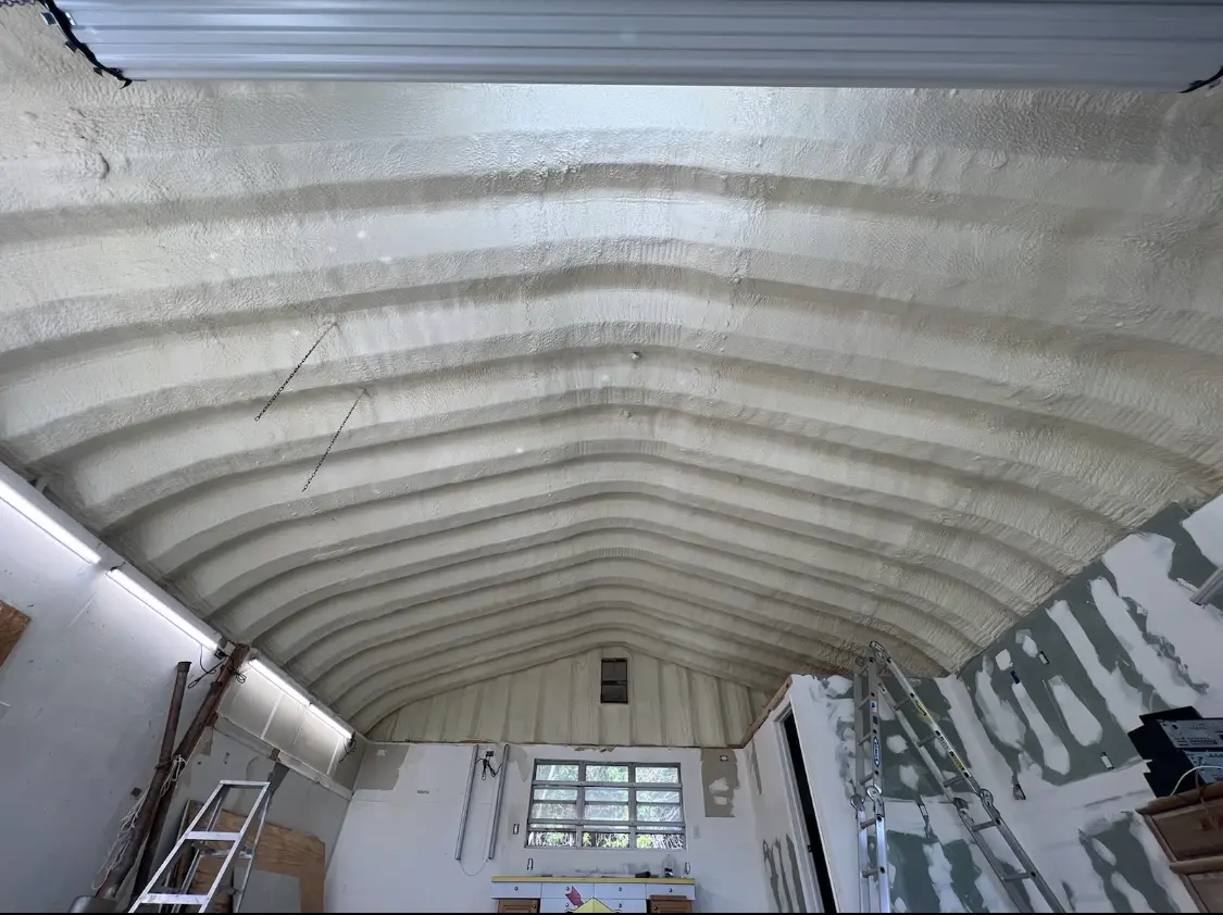 Spray polyurethane foam applied to the underside of a metal roof deck in Palo Alto